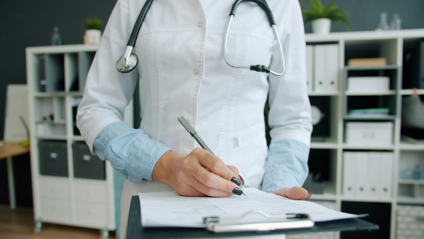 Clinician reviewing medical documentation