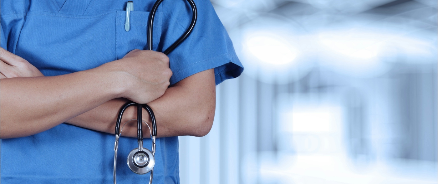 Clinician in hospital corridor