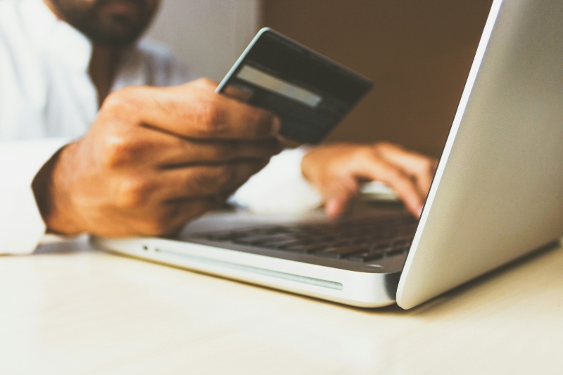Person paying securely online with credit card